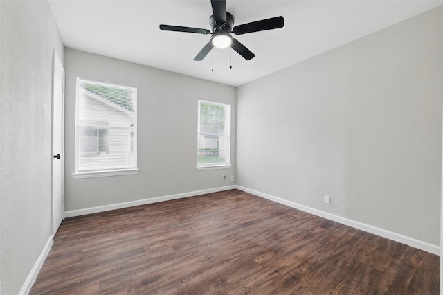 1625 Walnut St, Grand Prairie, TX 75050 - empty room featuring dark wood-type flooring, baseboards, and ceiling fan