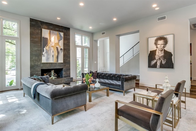 4678 Christopher Pl, Dallas, TX 75204 - living room featuring recessed lighting, a tiled fireplace, and light colored carpet