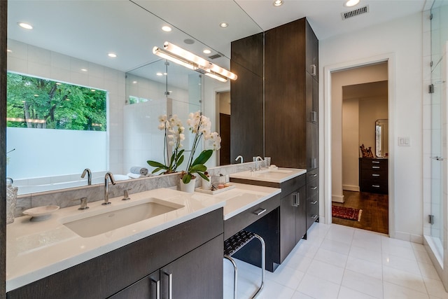 4678 Christopher Pl, Dallas, TX 75204 - full bath with tile patterned floors, a stall shower, double vanity, and recessed lighting
