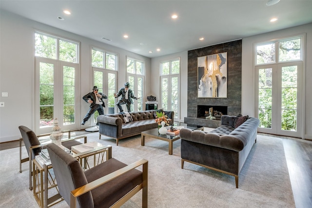 4678 Christopher Pl, Dallas, TX 75204 - living room featuring healthy amount of natural light, recessed lighting, a fireplace, and light wood finished floors