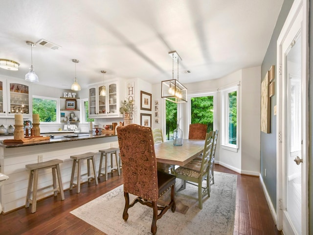 1951 Ravenwood Dr, Keller, TX 76262 - dining room with dark wood-style floors and baseboards