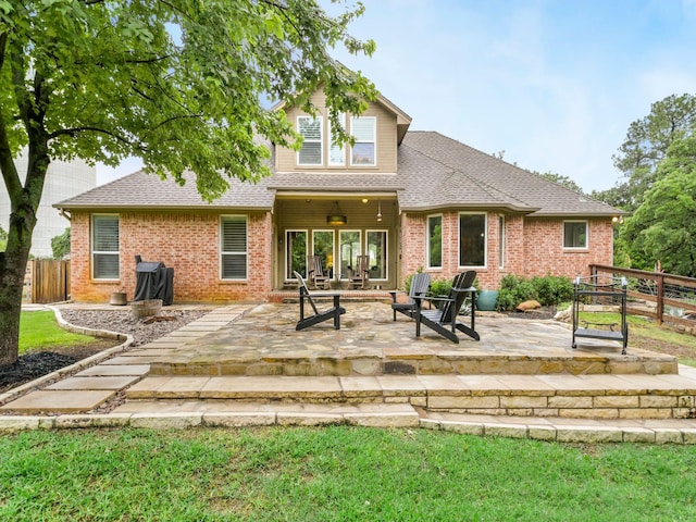 1951 Ravenwood Dr, Keller, TX 76262 - rear view of property with a ceiling fan, brick siding, a patio area, and a shingled roof