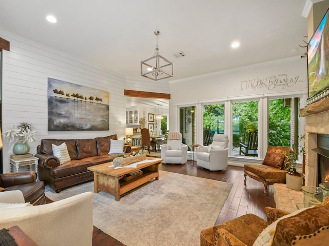 1951 Ravenwood Dr, Keller, TX 76262 - living room featuring a chandelier, dark wood finished floors, a lit fireplace, ornamental molding, and recessed lighting