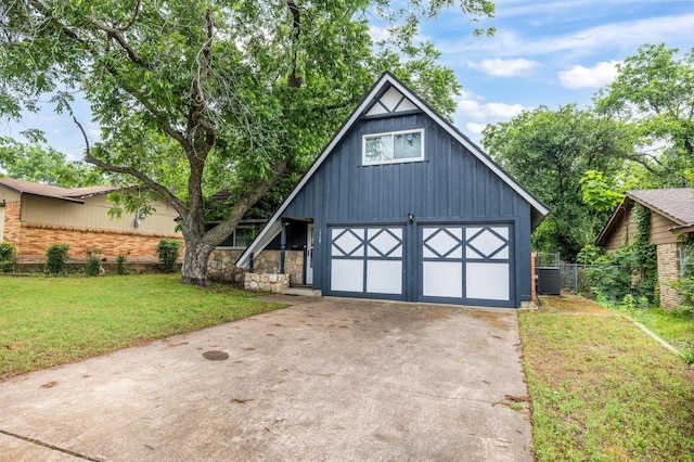 1728 Foster Dr, Arlington, TX 76012 - view of front of house with board and batten siding and a detached garage