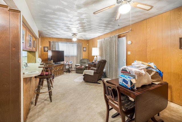 1728 Foster Dr, Arlington, TX 76012 - office area featuring ceiling fan, light colored carpet, and wooden walls
