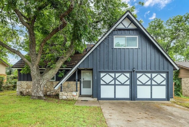 1728 Foster Dr, Arlington, TX 76012 - view of front facade featuring board and batten siding, driveway, a garage, and a front yard