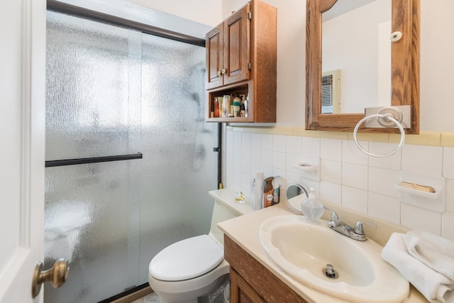 1728 Foster Dr, Arlington, TX 76012 - bathroom featuring a shower stall, toilet, backsplash, and vanity