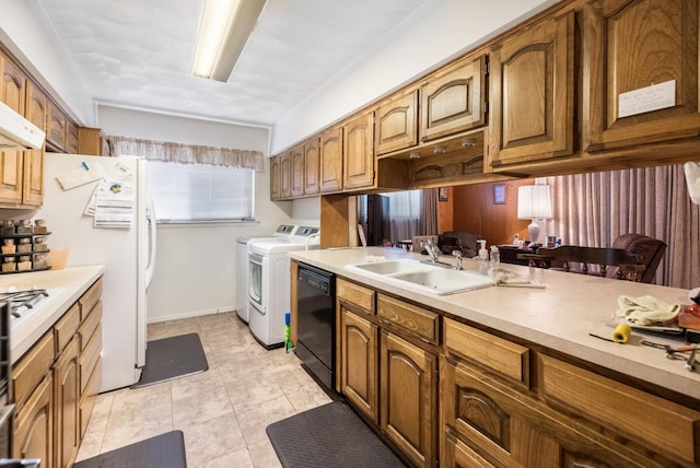 1728 Foster Dr, Arlington, TX 76012 - kitchen featuring washing machine and clothes dryer, a sink, black dishwasher, and light countertops