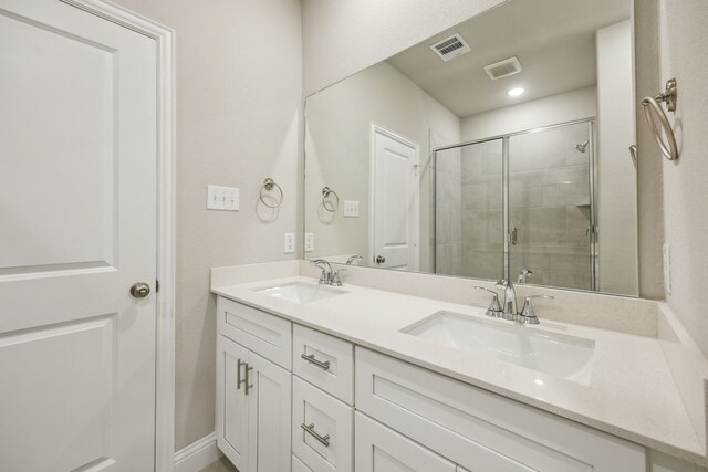 904 Santa Lucia Dr, Anna, TX 75409 - full bathroom with double vanity, a shower stall, and recessed lighting