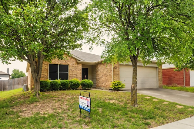 4009 Shiraz Dr, Denton, TX 76226 - view of front of property featuring brick siding, concrete driveway, and an attached garage
