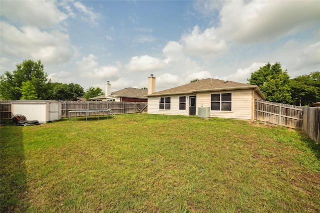 4009 Shiraz Dr, Denton, TX 76226 - rear view of property featuring a trampoline and central air condition unit