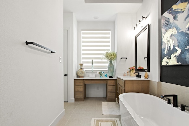 16098 Garganey Ct, Frisco, TX 75035 - full bath featuring a freestanding tub, vanity, and baseboards