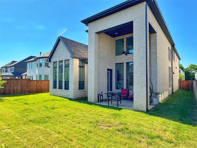 16098 Garganey Ct, Frisco, TX 75035 - rear view of house featuring brick siding and a patio area