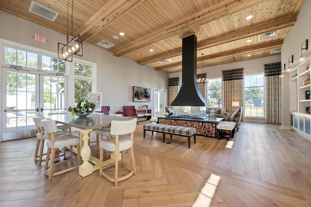 16098 Garganey Ct, Frisco, TX 75035 - dining area featuring wooden ceiling with exposed beams, a chandelier, recessed lighting, and french doors