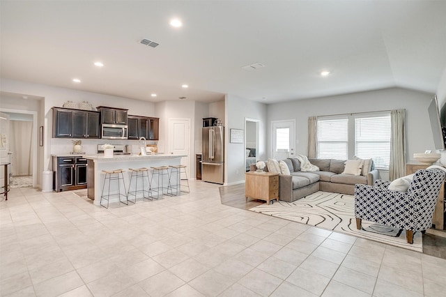 16556 White Fish Ln, Justin, TX 76247 - living area with recessed lighting, light tile patterned flooring, and lofted ceiling