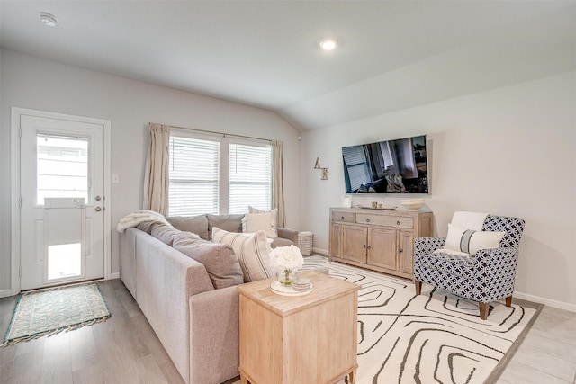 16556 White Fish Ln, Justin, TX 76247 - living area with baseboards, vaulted ceiling, and light wood-style floors