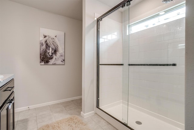 16556 White Fish Ln, Justin, TX 76247 - bathroom with a shower stall, vanity, baseboards, and tile patterned floors