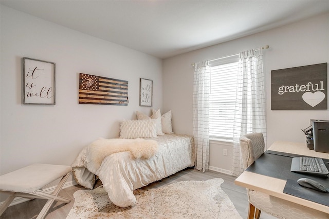 16556 White Fish Ln, Justin, TX 76247 - bedroom with an office area, baseboards, and wood finished floors