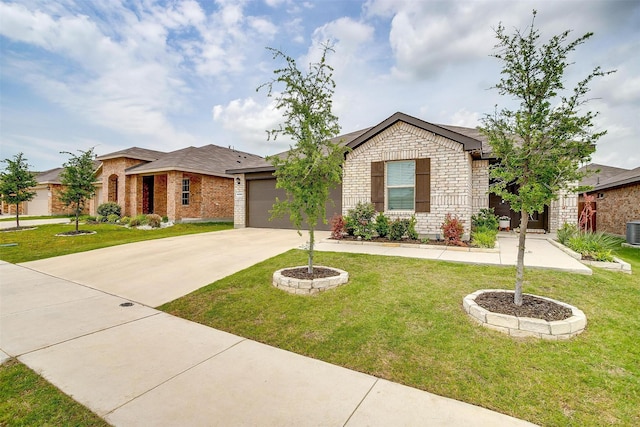 16556 White Fish Ln, Justin, TX 76247 - ranch-style house with driveway, brick siding, an attached garage, and a front lawn