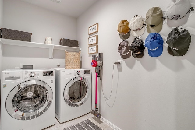 16556 White Fish Ln, Justin, TX 76247 - laundry area featuring washing machine and clothes dryer, light tile patterned floors, and baseboards