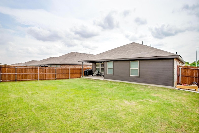 16556 White Fish Ln, Justin, TX 76247 - rear view of property featuring a patio area and a shingled roof