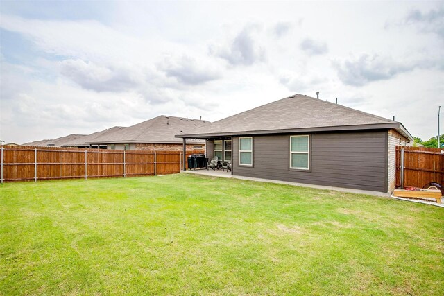 16556 White Fish Ln, Justin, TX 76247 - back of property featuring a patio area and roof with shingles