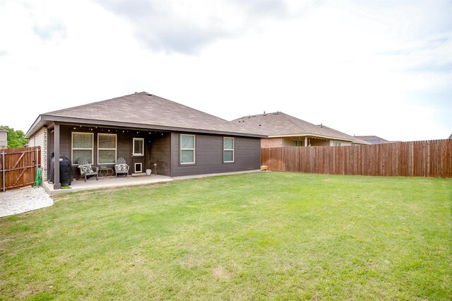 16556 White Fish Ln, Justin, TX 76247 - back of house with a patio