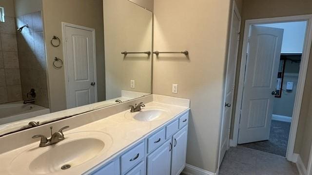 8602 Venezia Terrace Ct, Cypress, TX 77433 - full bathroom with baseboards, double vanity, tile patterned floors, and bathing tub / shower combination