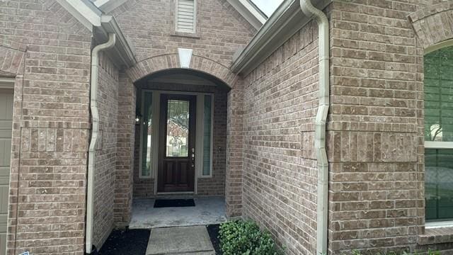 8602 Venezia Terrace Ct, Cypress, TX 77433 - doorway to property featuring brick siding