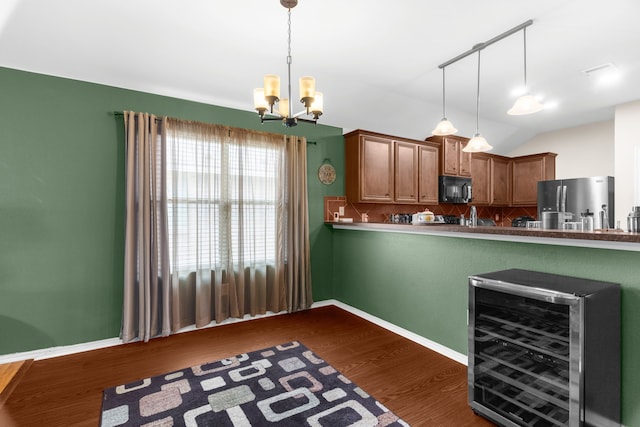 805 Canyon Pl, Desoto, TX 75115 - kitchen with black microwave, stainless steel refrigerator with ice dispenser, backsplash, a chandelier, and wine cooler