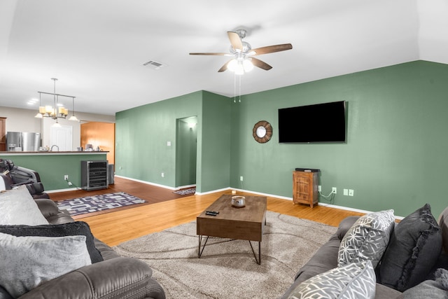 805 Canyon Pl, Desoto, TX 75115 - living area featuring wood finished floors, a ceiling fan, baseboards, and a chandelier