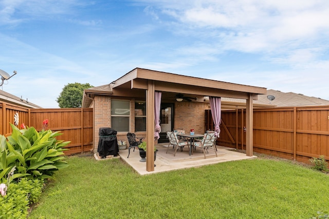 805 Canyon Pl, Desoto, TX 75115 - rear view of house with a ceiling fan, brick siding, and a patio
