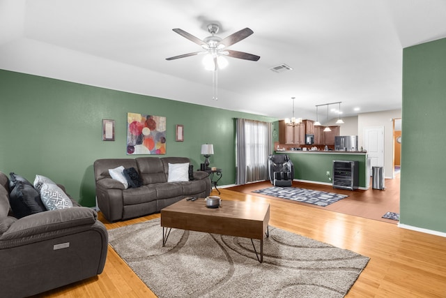 805 Canyon Pl, Desoto, TX 75115 - living room featuring light wood finished floors, ceiling fan, baseboards, and beverage cooler