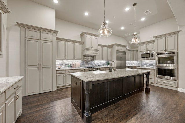 2100 Veranda Ave, Trophy Club, TX 76262 - kitchen featuring built in appliances, backsplash, dark wood-style floors, a center island with sink, and recessed lighting