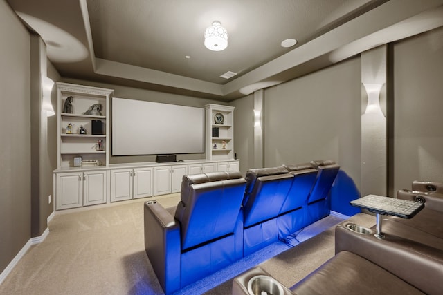 2100 Veranda Ave, Trophy Club, TX 76262 - home theater featuring a tray ceiling, light colored carpet, baseboards, and built in features