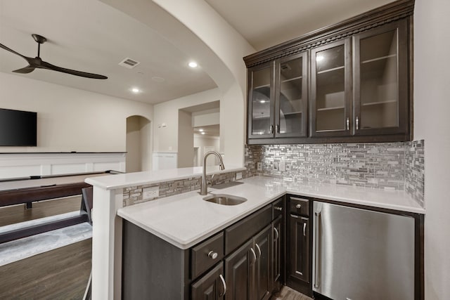 2100 Veranda Ave, Trophy Club, TX 76262 - kitchen with a sink, ceiling fan, fridge, arched walkways, and tasteful backsplash