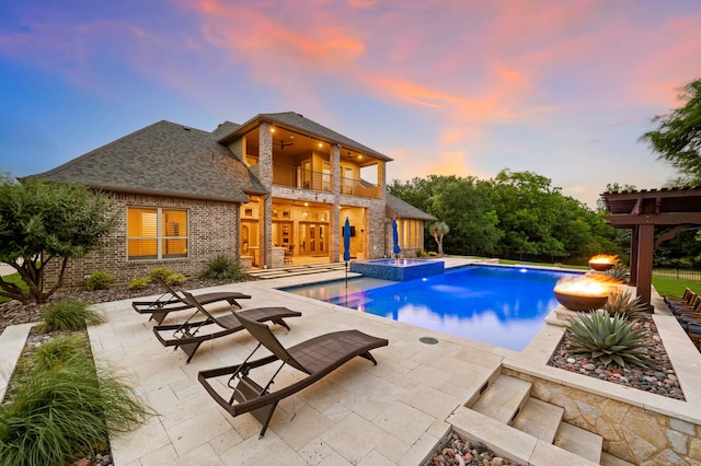 2100 Veranda Ave, Trophy Club, TX 76262 - pool at dusk with a patio area, a ceiling fan, and a pool with connected hot tub