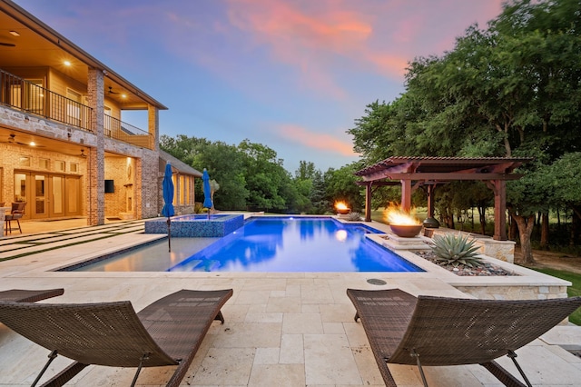 2100 Veranda Ave, Trophy Club, TX 76262 - pool at dusk with a pergola, a patio area, french doors, and a pool with connected hot tub