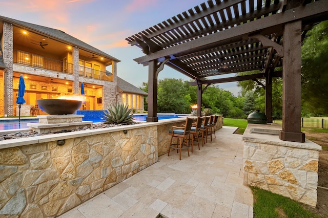 2100 Veranda Ave, Trophy Club, TX 76262 - patio terrace at dusk with a grill, a pergola, an outdoor pool, and a patio
