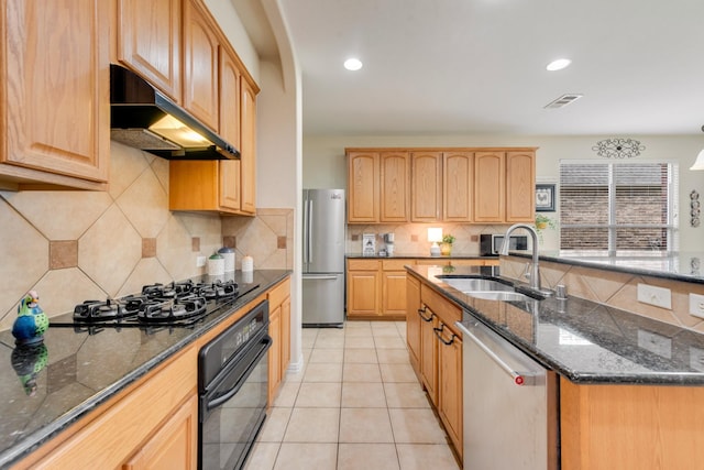 1090 Potter Ave, Rockwall, TX 75087 - kitchen featuring black appliances, under cabinet range hood, a sink, dark stone countertops, and backsplash
