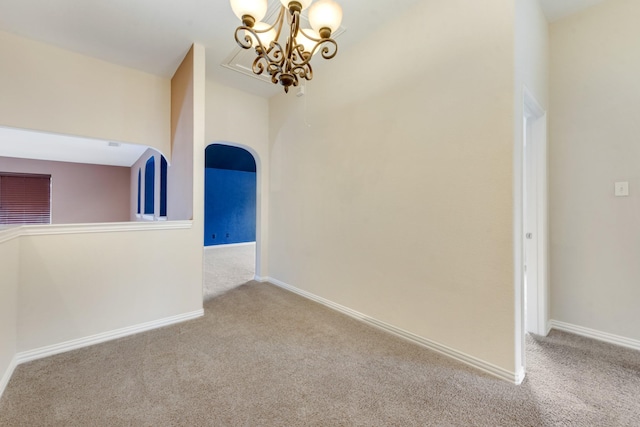 1090 Potter Ave, Rockwall, TX 75087 - spare room featuring carpet floors, a chandelier, baseboards, and arched walkways