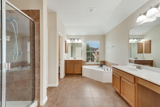 1090 Potter Ave, Rockwall, TX 75087 - full bathroom with a stall shower, a bath, two vanities, and tile patterned floors