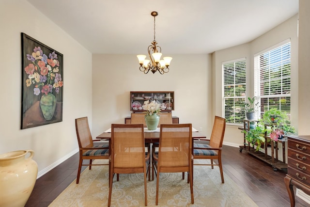 1090 Potter Ave, Rockwall, TX 75087 - dining area with wood-type flooring, a chandelier, and baseboards