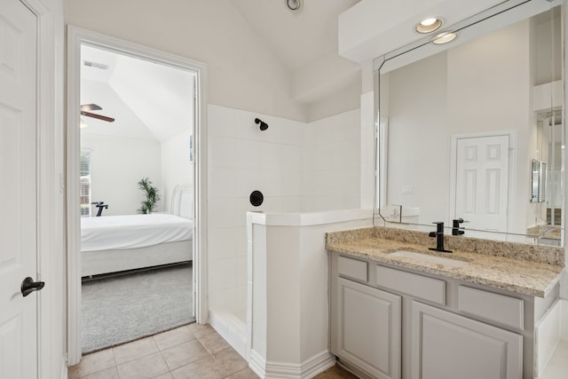 2628 Caddo Ct, Frisco, TX 75033 - bathroom with lofted ceiling, ensuite bath, vanity, a tile shower, and tile patterned flooring