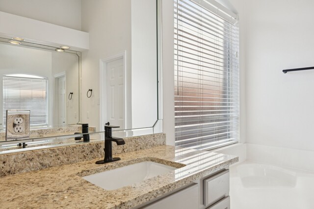 2628 Caddo Ct, Frisco, TX 75033 - full bath featuring vanity, healthy amount of natural light, and a garden tub