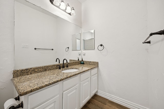 2628 Caddo Ct, Frisco, TX 75033 - bathroom featuring wood finished floors and vanity