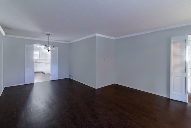 8351-8353 Lullwater Dr, Dallas, TX 75218 - spare room featuring dark wood-style floors, ornamental molding, and baseboards