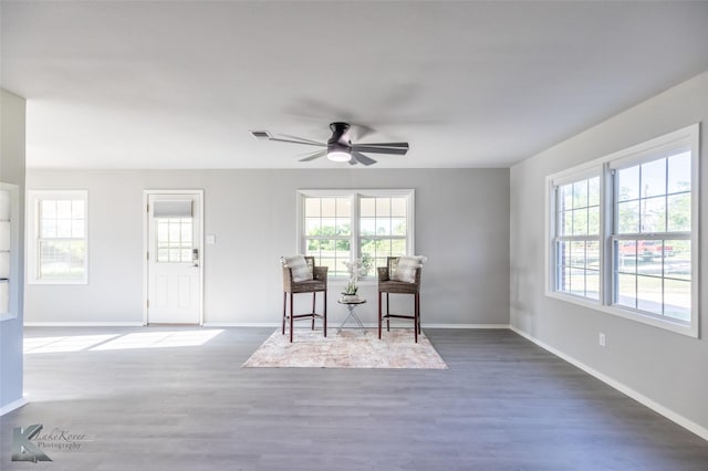 821 Cherry Ln, Clyde, TX 79510 - living area with plenty of natural light, a ceiling fan, wood finished floors, and baseboards