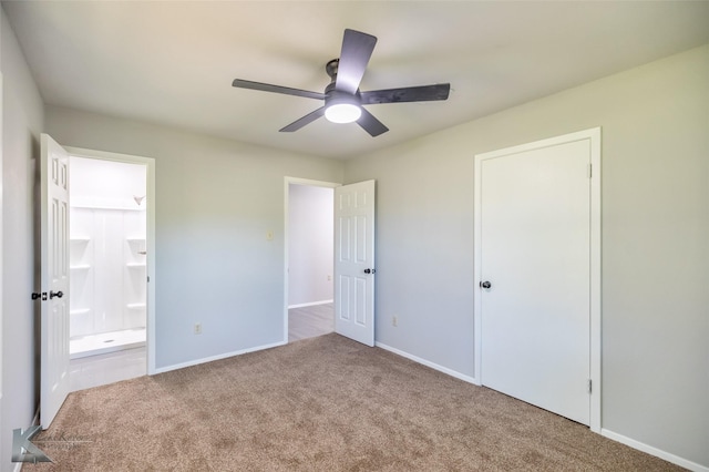 821 Cherry Ln, Clyde, TX 79510 - unfurnished bedroom with carpet floors, connected bathroom, baseboards, and a ceiling fan