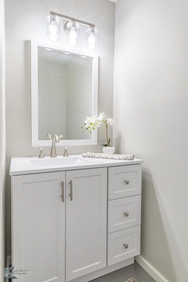 821 Cherry Ln, Clyde, TX 79510 - bathroom featuring vanity and baseboards